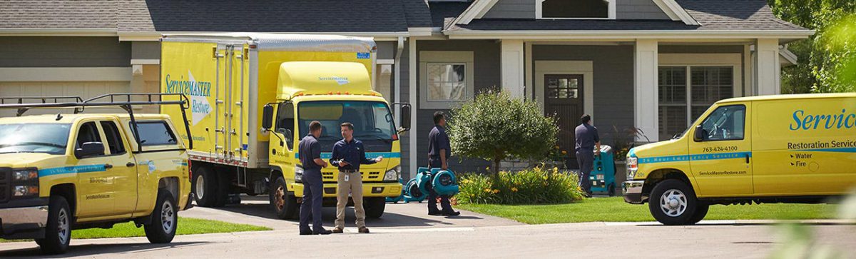 ServiceMaster Restoration By Simons truck outside single family home